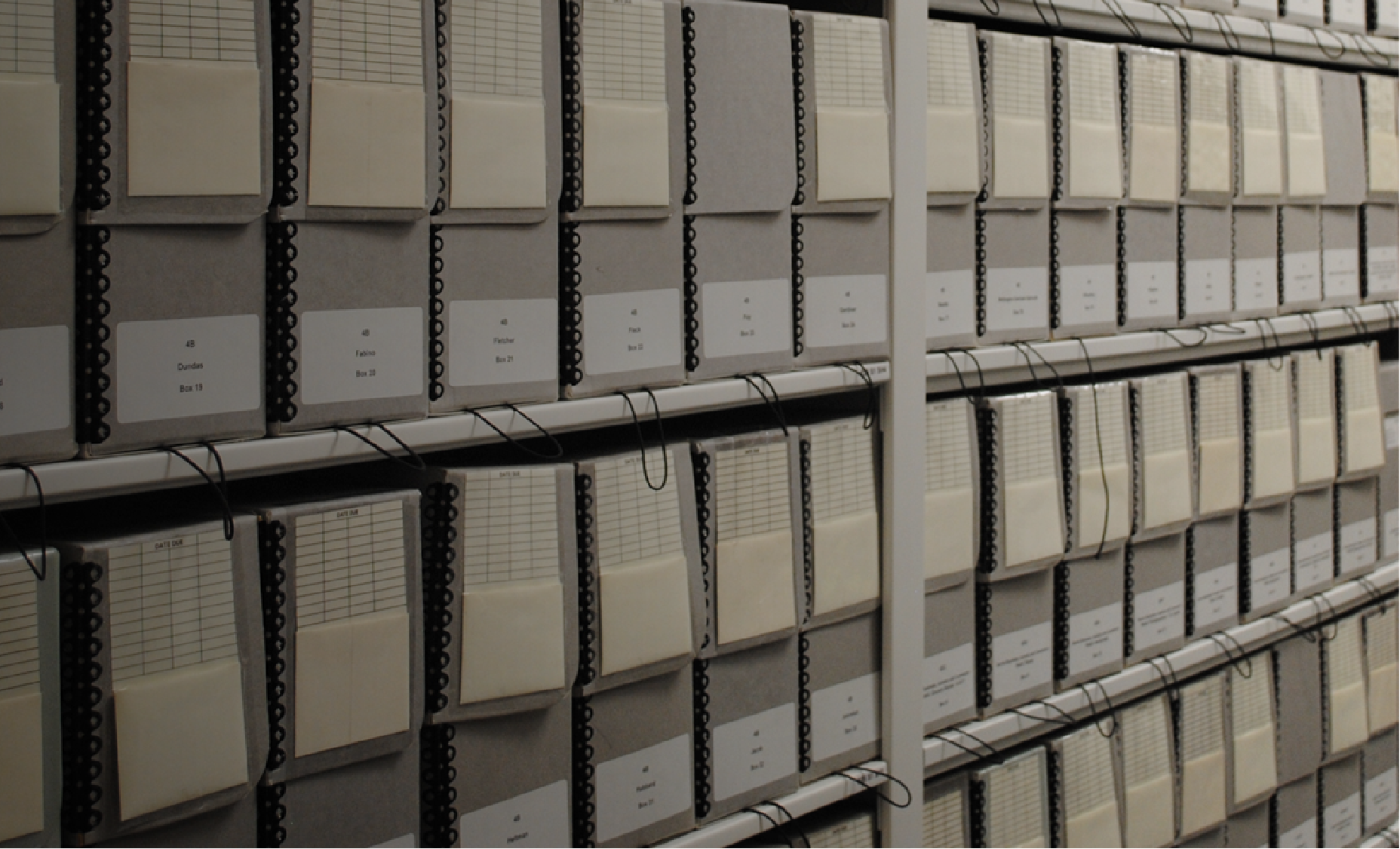 Photo of the Archives' collection in boxes on a shelf.