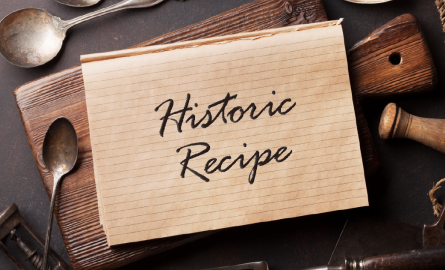Old utensils with card and text, "Historical Recipe".