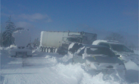 Vehicle pile up on a snowy road.