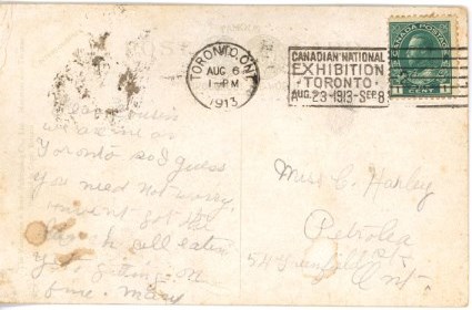 Back of a post card with writing.