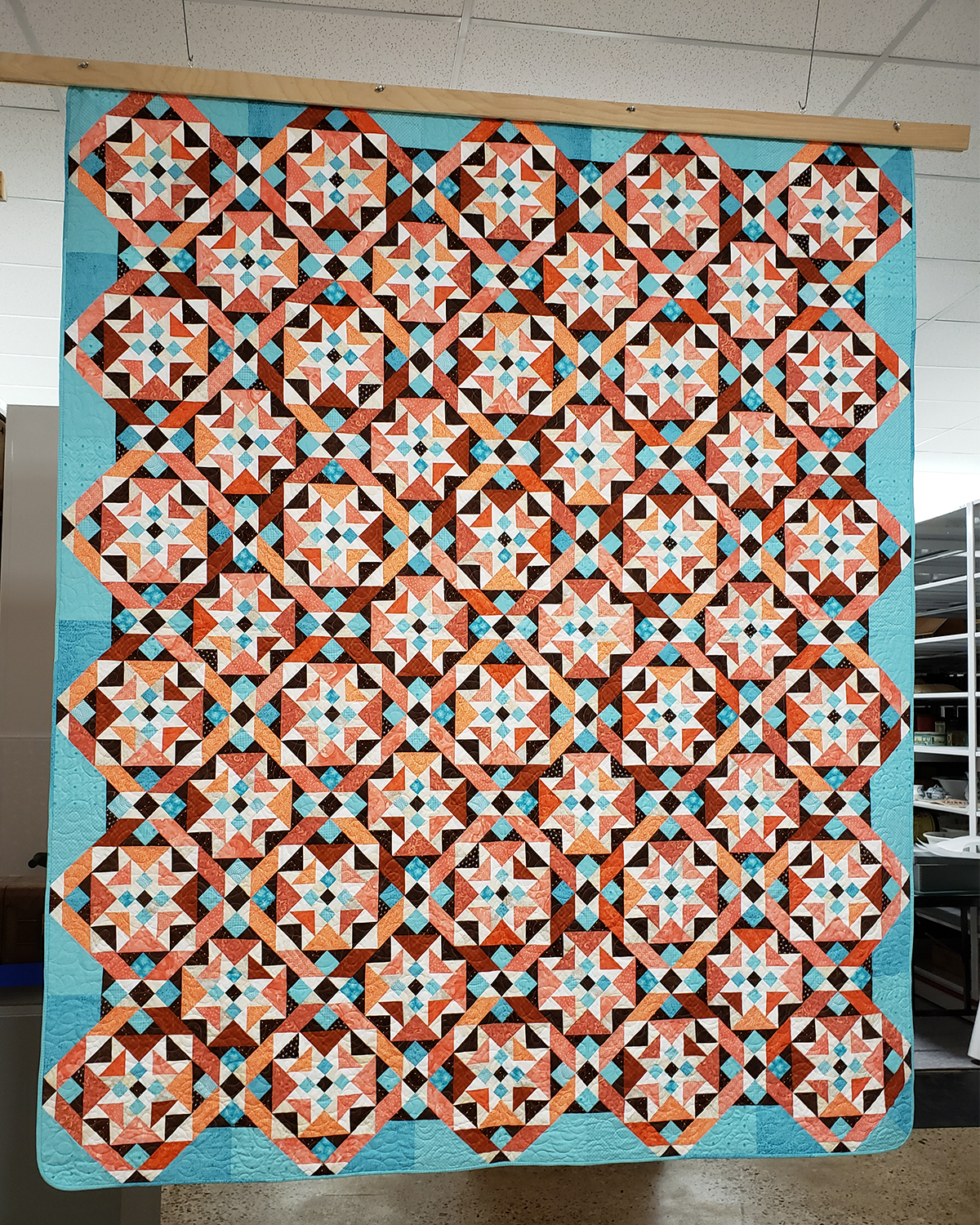 Quilt hanging on display