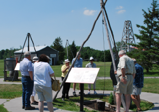 People around outdoor exhibit at the Oil Museum of Canada