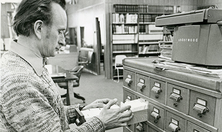 Man standing in a library.