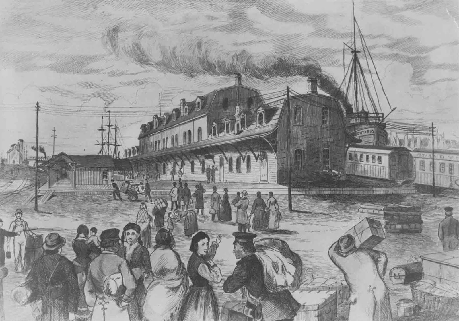 A detailed black and white illustration shows a bustling scene of immigrants arriving at a large railway and steamship terminal, with crowds of people, luggage, and transport vehicles surrounding the grand station building.