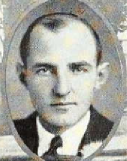 Black and white headshot of a man.