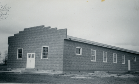 Black and white image of a brick building.