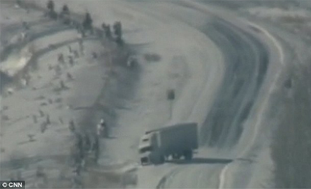 Transport truck stuck in the ditch in a snowstorm.