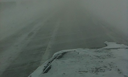 View from a truck window in a snowstorm.