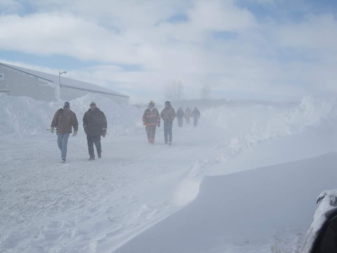 Men walking in the snow.