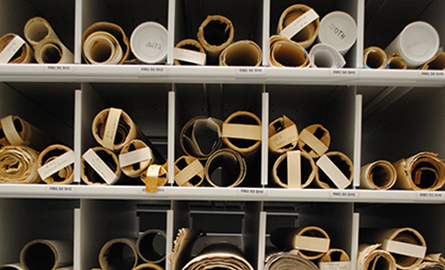Scrolls on a shelf.