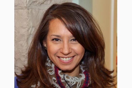 Headshot of brown haired lady.