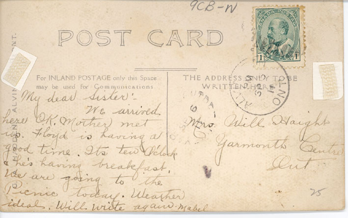 Back of a post card with writing.