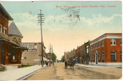 Coloured photo of old cars in downtown Petrolia.