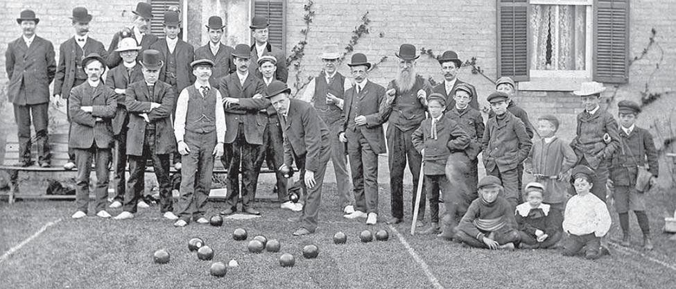 A group of men and boys who make up the First Lawn Bowling Club, Watford. 