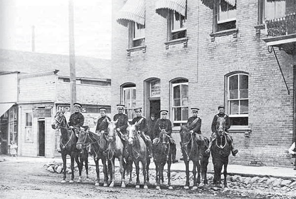 27th Regiment on horses, standing in front of Roche House.