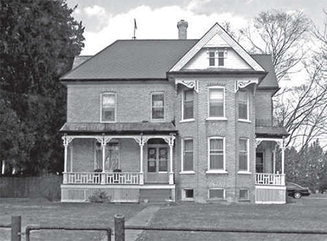 McKenzie house, a two story Warwick style house. 