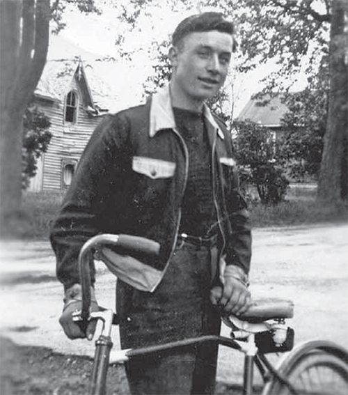 Cy Hewitt, age 18, with a bike.