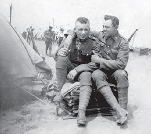 Ivan Bryce, Russell Duncan sitting beside a tent.