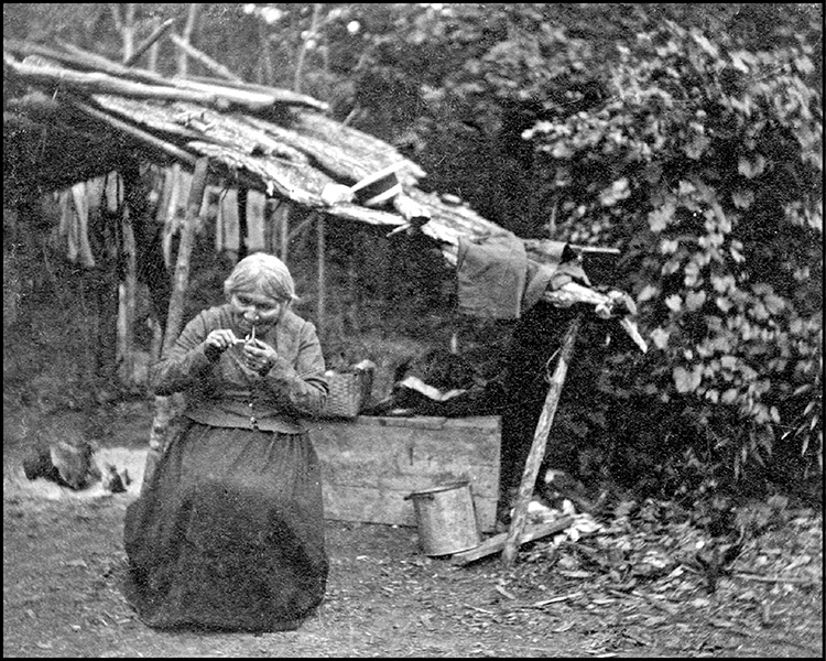 Madam Mindiski smoking a pipe.