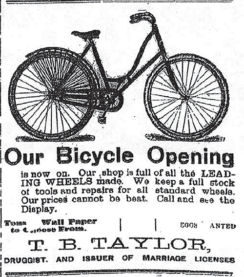 T. B. Taylor bicycle advertisement with an illustration of a bicycle on it.