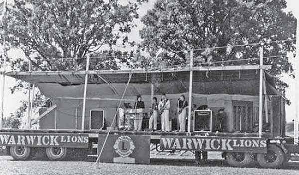 A band plays on a trailer-stage at the Warwick Lions Club Jamboree at the Warwick Ball Park. 