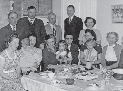 Farm Radio Forum meeting, with people around a table.