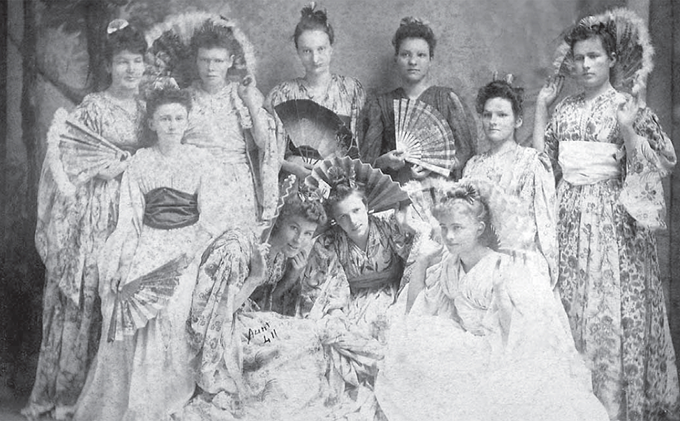 A group of women dressed up to be in a play.