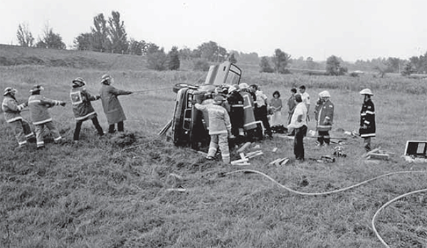  Fire Department volunteers practice dealing with a flipped car accident.