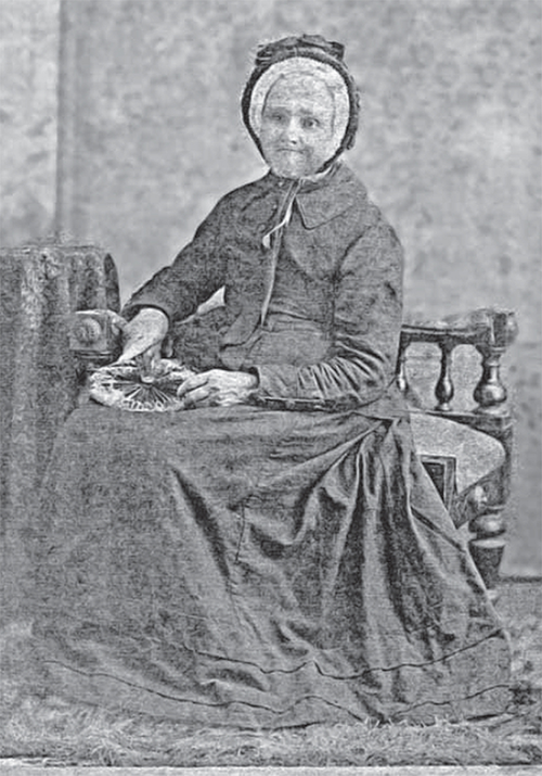Hannah Linnell, wife of Joseph Clark sitting on a chair.
