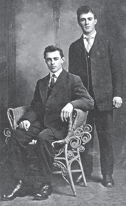 Russell and Walter Duncan in front of a backdrop.