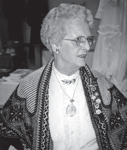 Janet Firman wearing jewellery and shawl belonging to her great-grandmother.
