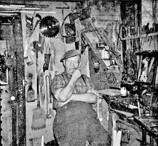 Leo Martin in a workshop filled with tools.