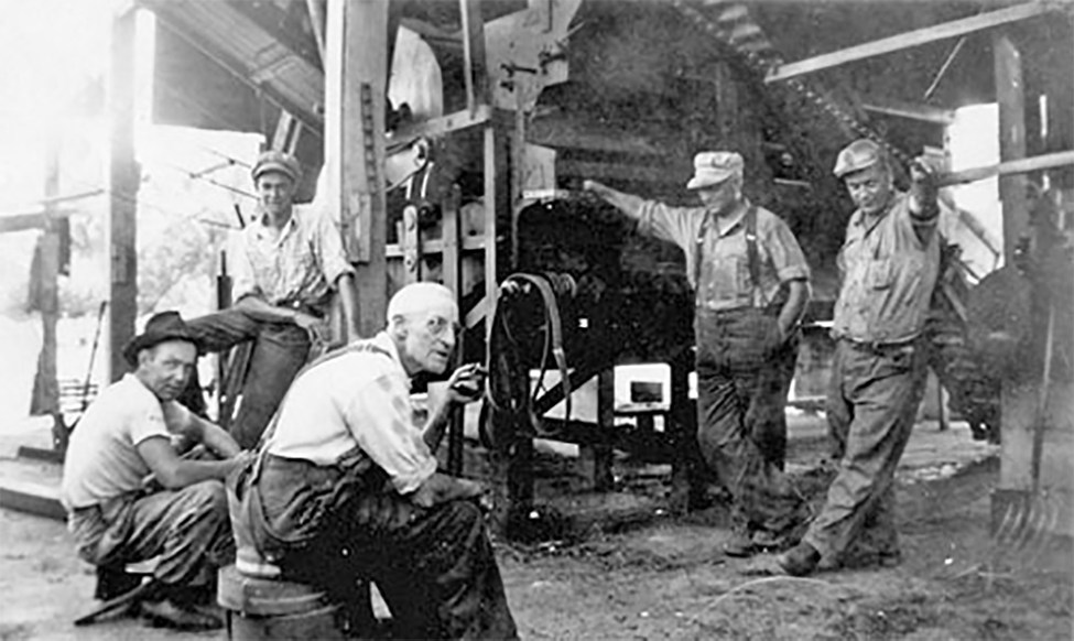 Five men, Pea viners, at break time.