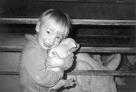 Sheena Geerts holding a prized piglet.