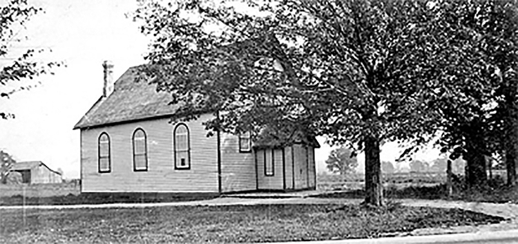 Methodist Church behind some trees.