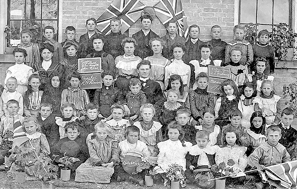 SS#2 Kelvin Grove school children standing in front of British flags in 1903