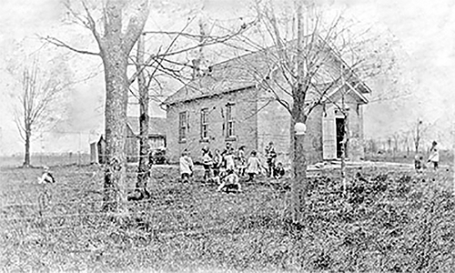 Children at play outside the school house, SS#19.