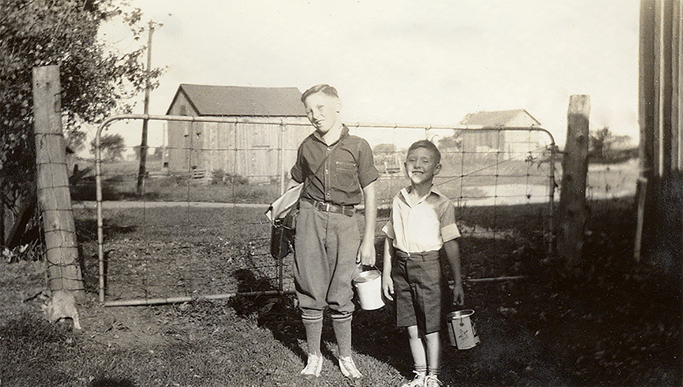Jack and LaVerne McPherson holding lunch pail buckets.