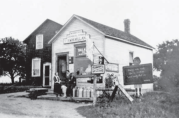 McMillan Store with people sitting out front.