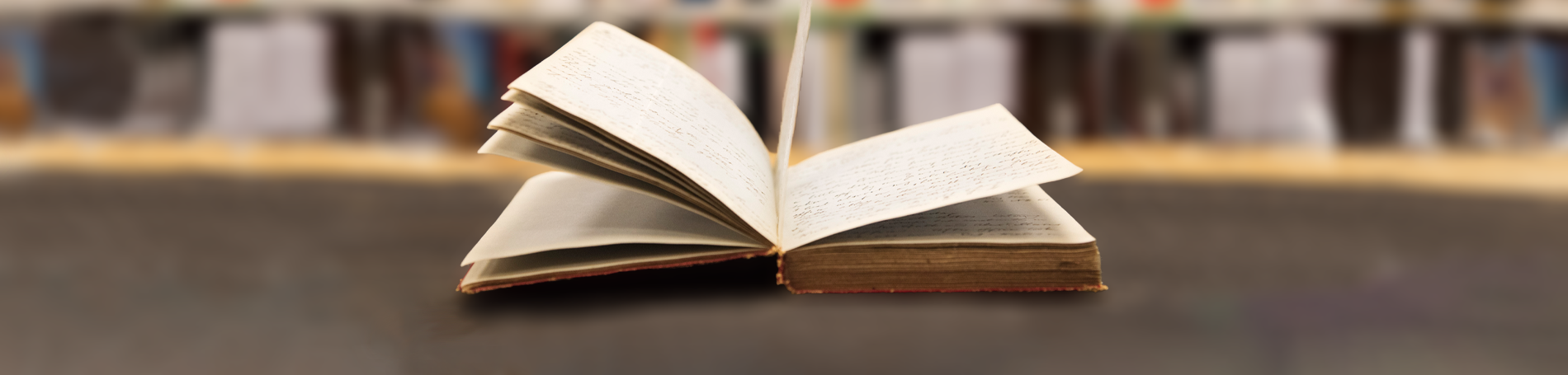 An old book open on a desk