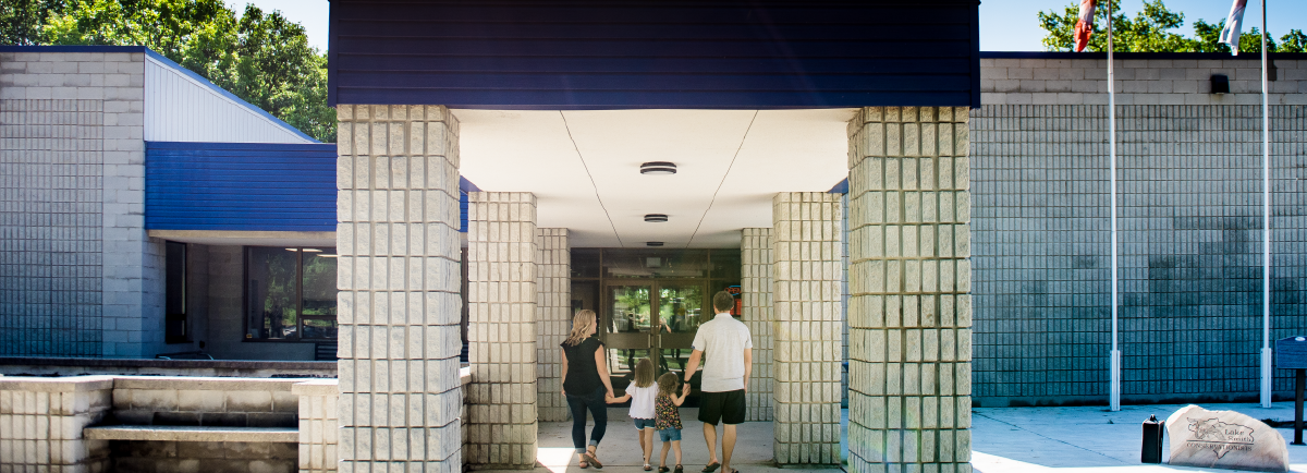 Couple walking into Lambton Heritage Museum entrance. 