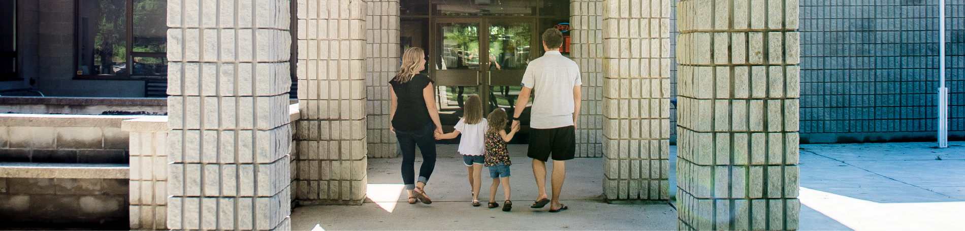 Family walking in entrance to Lambton Heritage Museum.