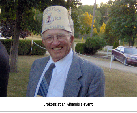 Charlie Srokosz wearing his Alhambra fez. Image Caption: "Srokosz at an Alhambra event."