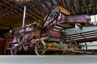 Large red Goodison thresher in the LHM Brown Barn.