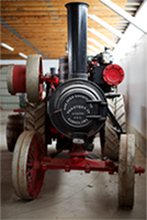 Front view of a Goodison Traction Steam Engine. Looks like a train with wheels.