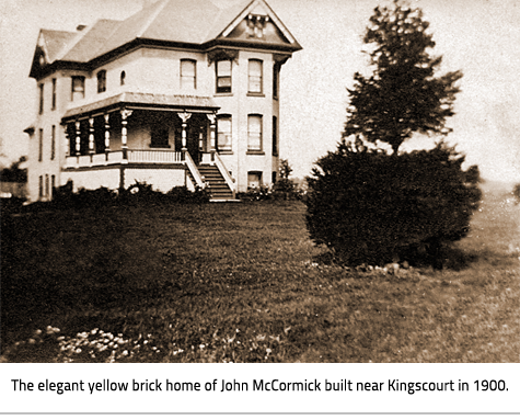 Sepia toned photo of a large photo with a veranda. Image Caption: The elegant yellow brick home of John McCormick built near Kingscourt in 1900. 