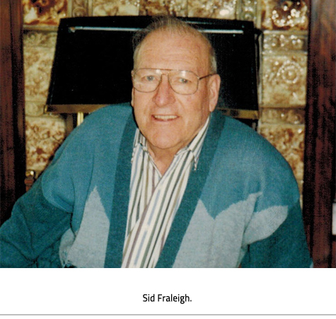 (Sid sitting in a chair. Image Caption: "Sid Fraleigh"), link.