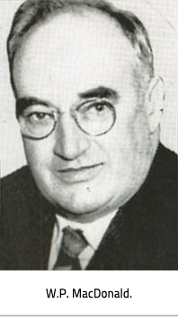 Portrait style photo of W.P. MacDonald wearing a suit and glasses. Image Caption: W.P. MacDonald.