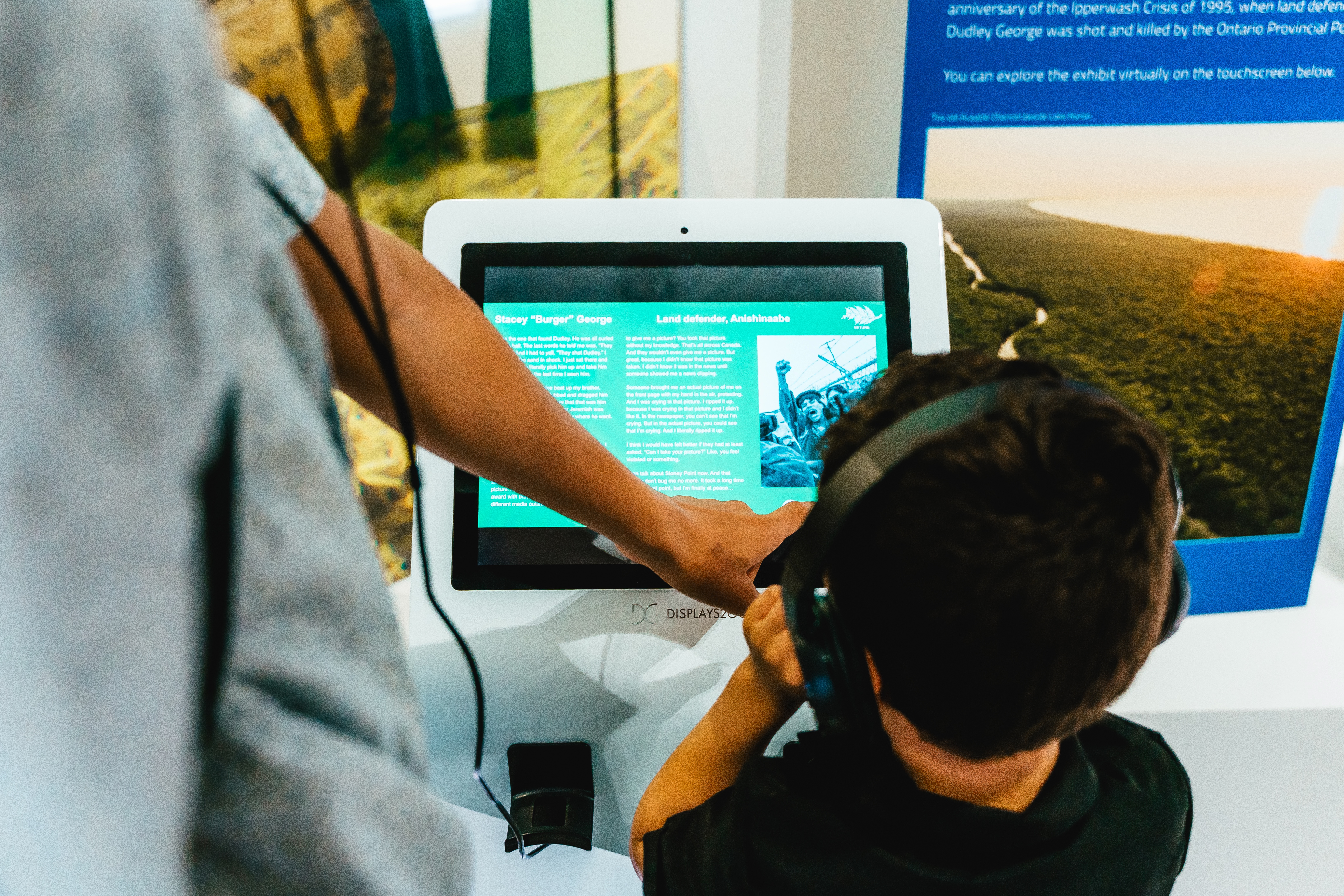 Child using touchscreen kiosk