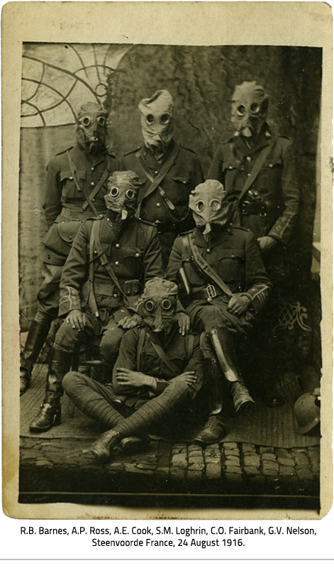 Portrait of six uniformed solders wearing gas masks, link.